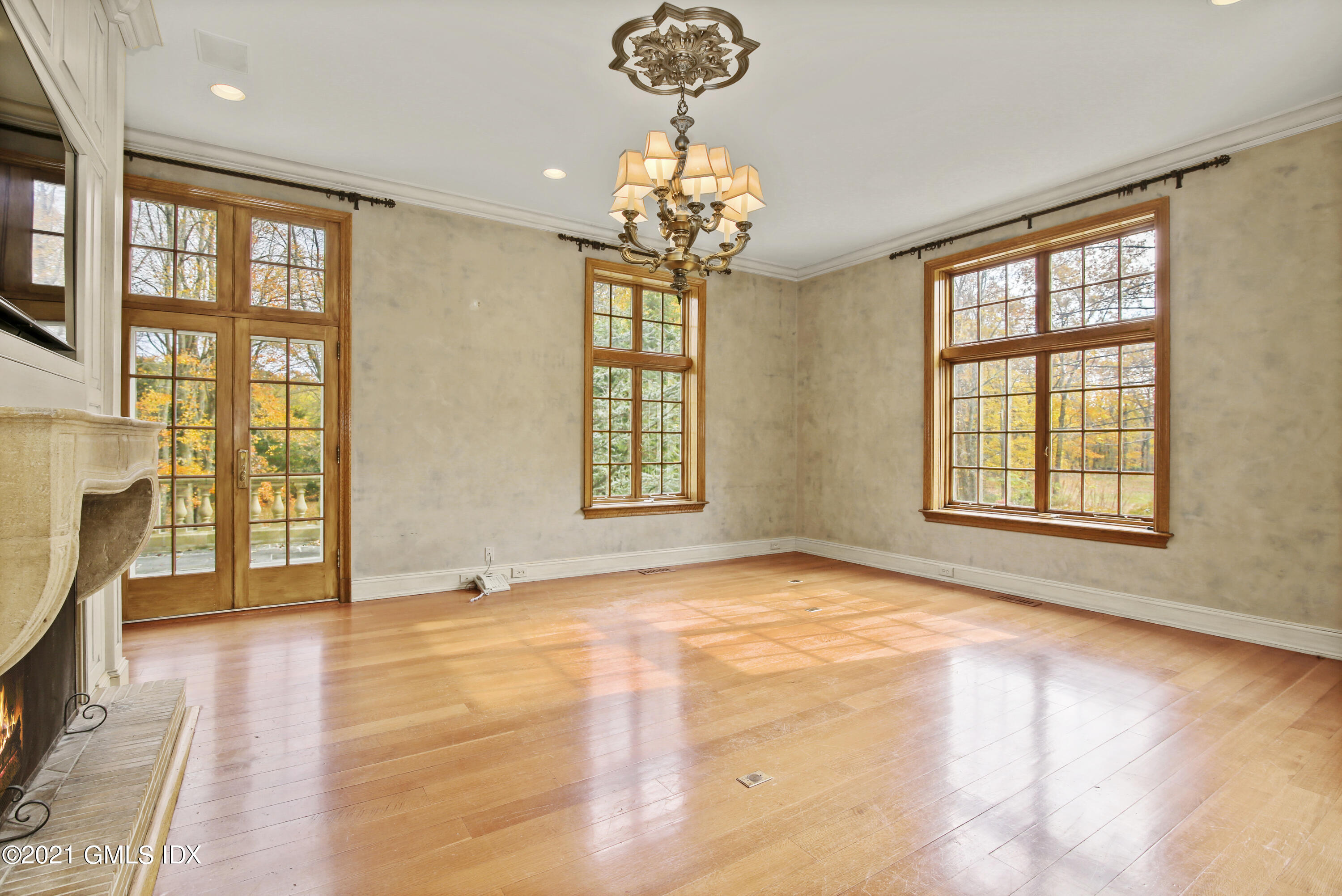 18 Lower Cross Road Greenwich, CT 06831 - Photo 21 of 40 a view of an empty room with a window and wooden floor