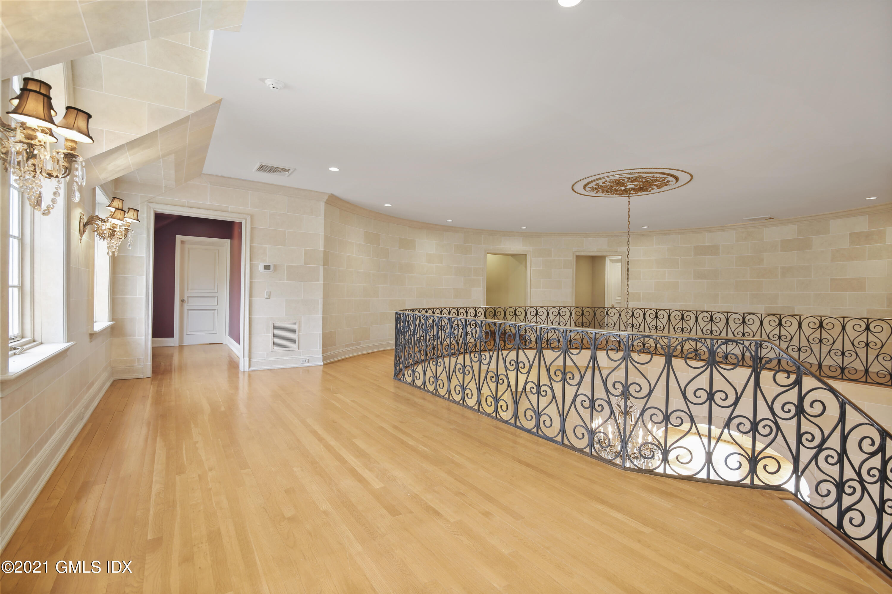 18 Lower Cross Road Greenwich, CT 06831 - Photo 22 of 40 a view of a hallway with wooden floor and stairs