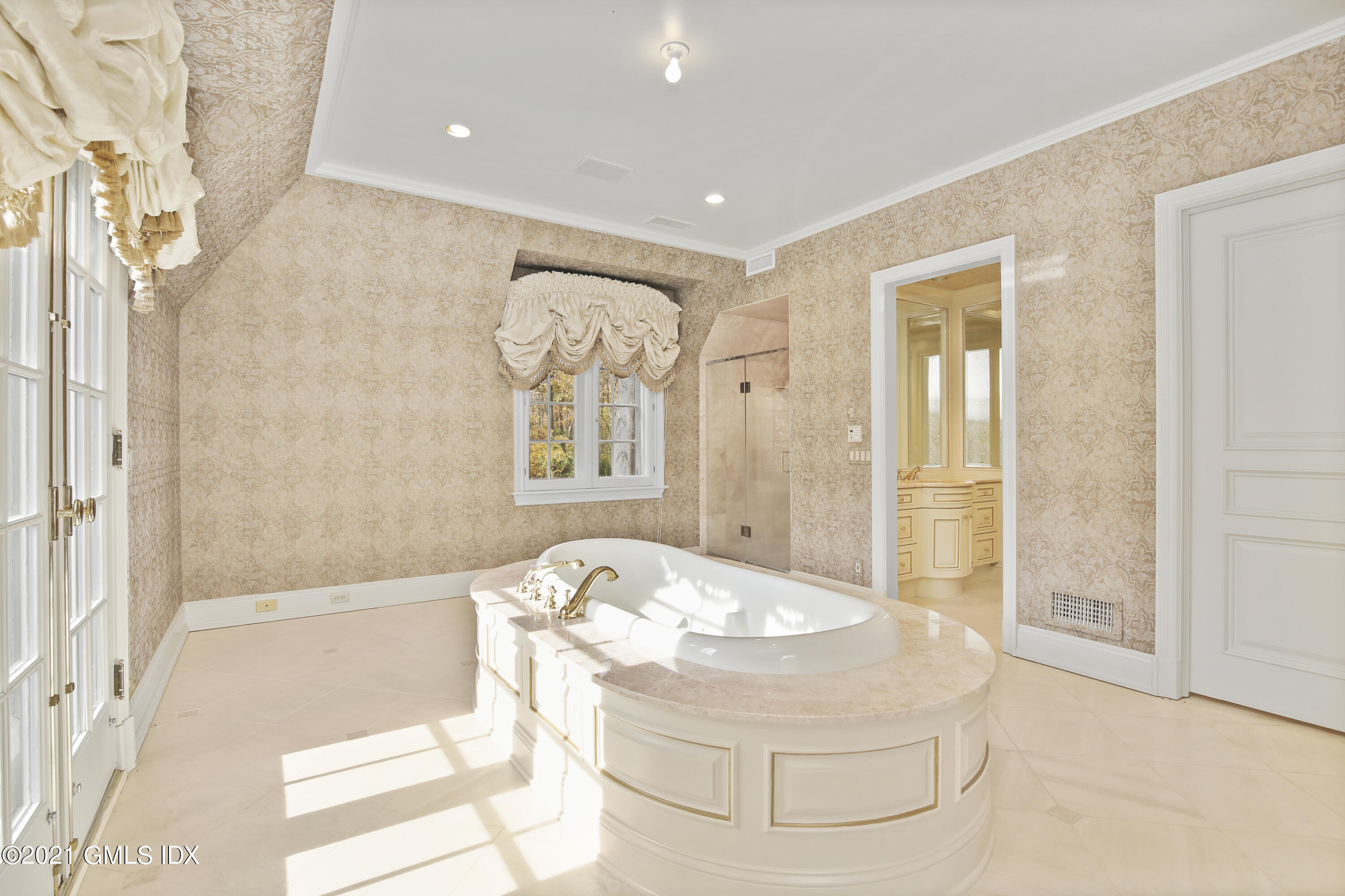 18 Lower Cross Road Greenwich, CT 06831 - Photo 26 of 40 a bathroom with a tub shower and mirror