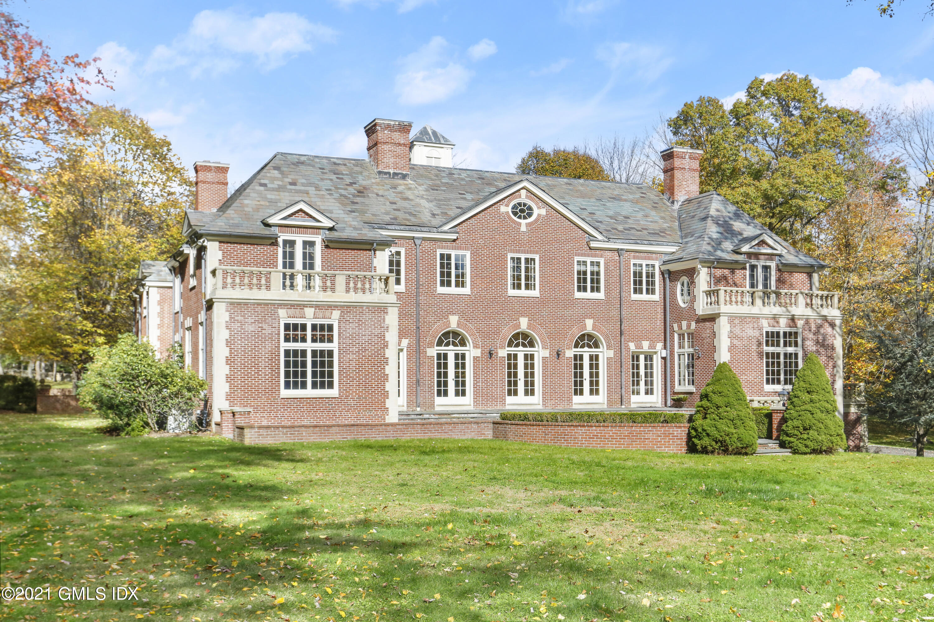 18 Lower Cross Road Greenwich, CT 06831 - Photo 34 of 40 a front view of a house with a garden