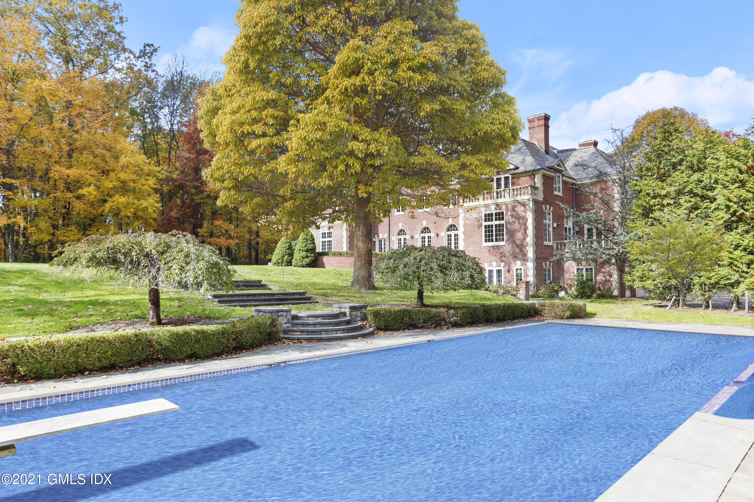 18 Lower Cross Road Greenwich, CT 06831 - Photo 35 of 40 a view of yard with swimming pool and green space