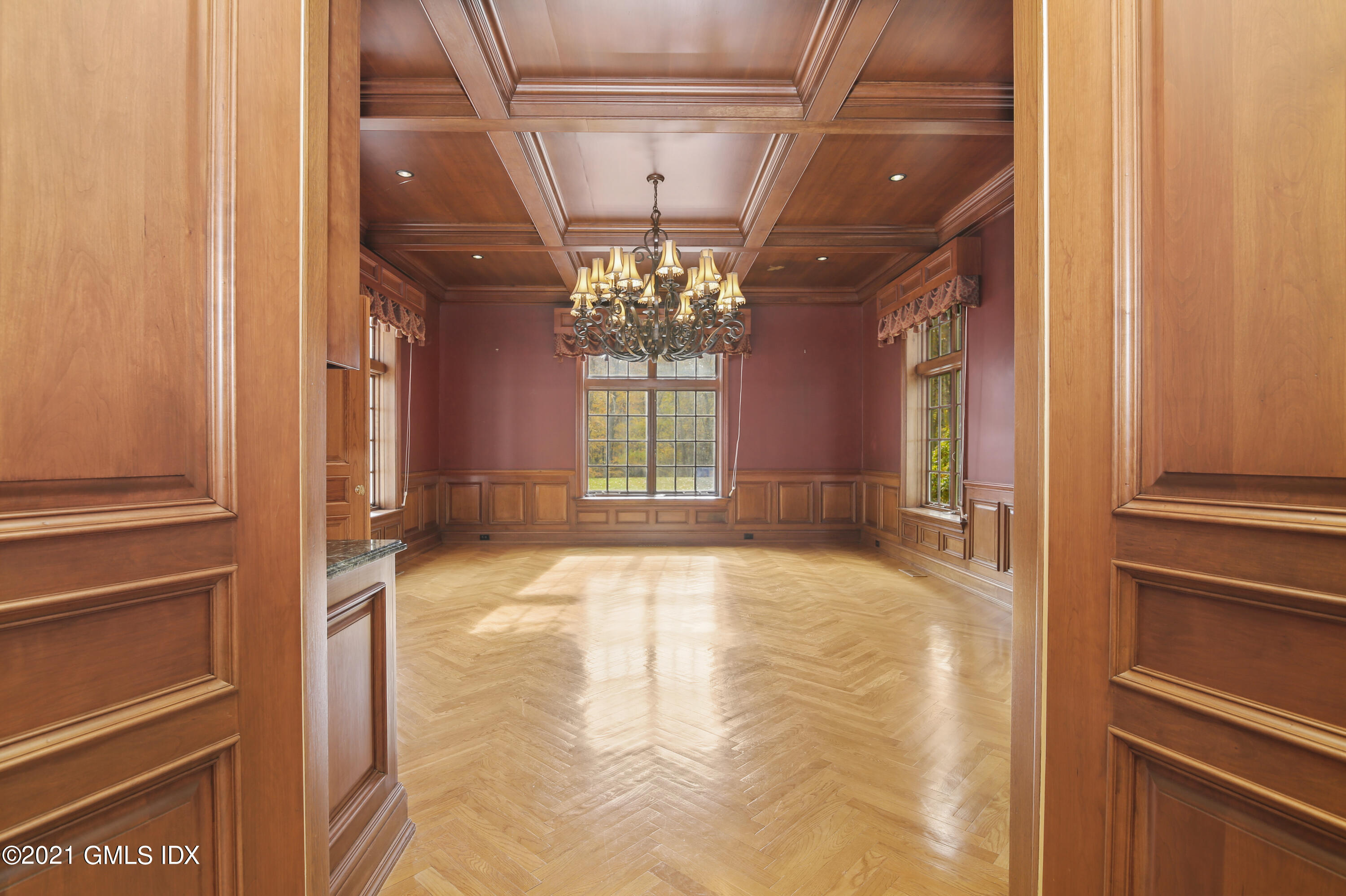 18 Lower Cross Road Greenwich, CT 06831 - Photo 9 of 40 a view of a hallway with a chandelier
