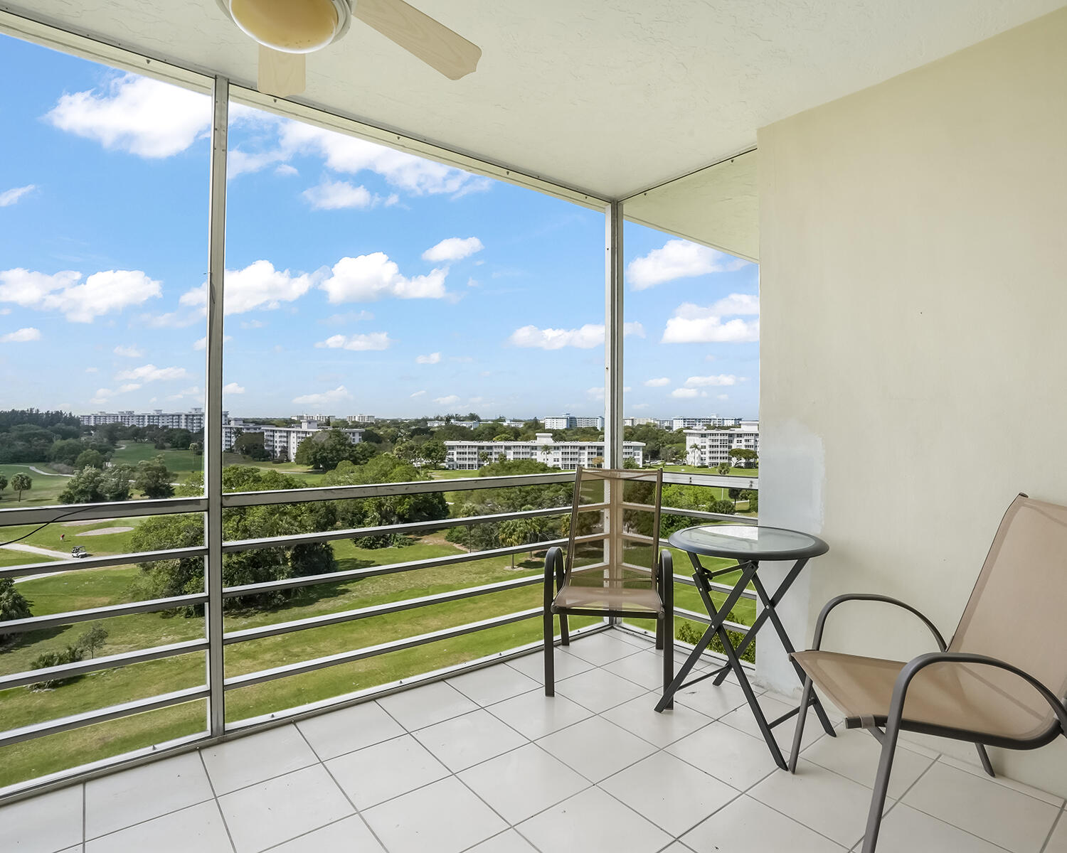 2671 South Course Drive, Unit 907 Pompano Beach, FL 33069 - Photo 1 of 21 a view of a bench in balcony