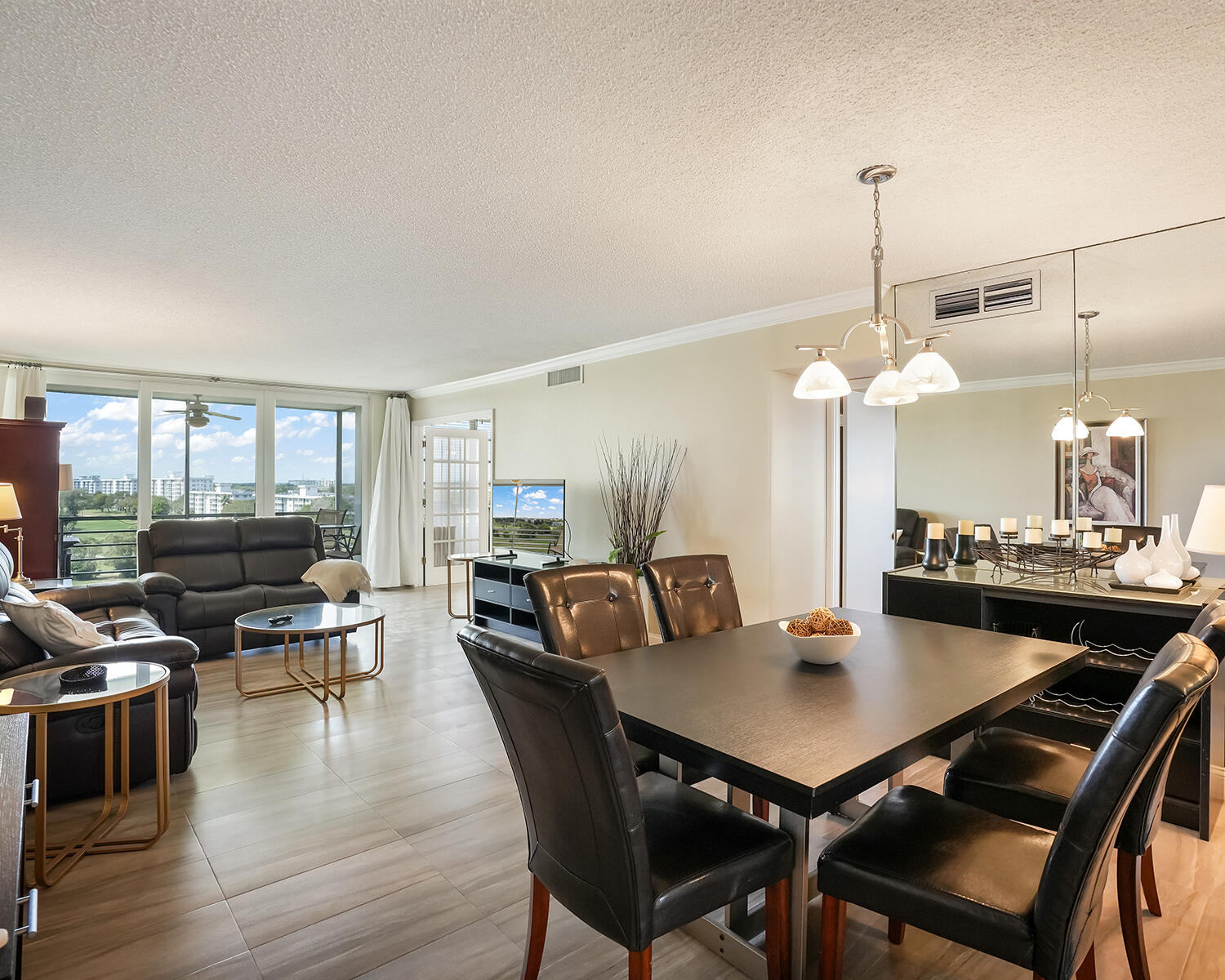 2671 South Course Drive, Unit 907 Pompano Beach, FL 33069 - Photo 13 of 21 a view of a dining room with furniture and wooden floor