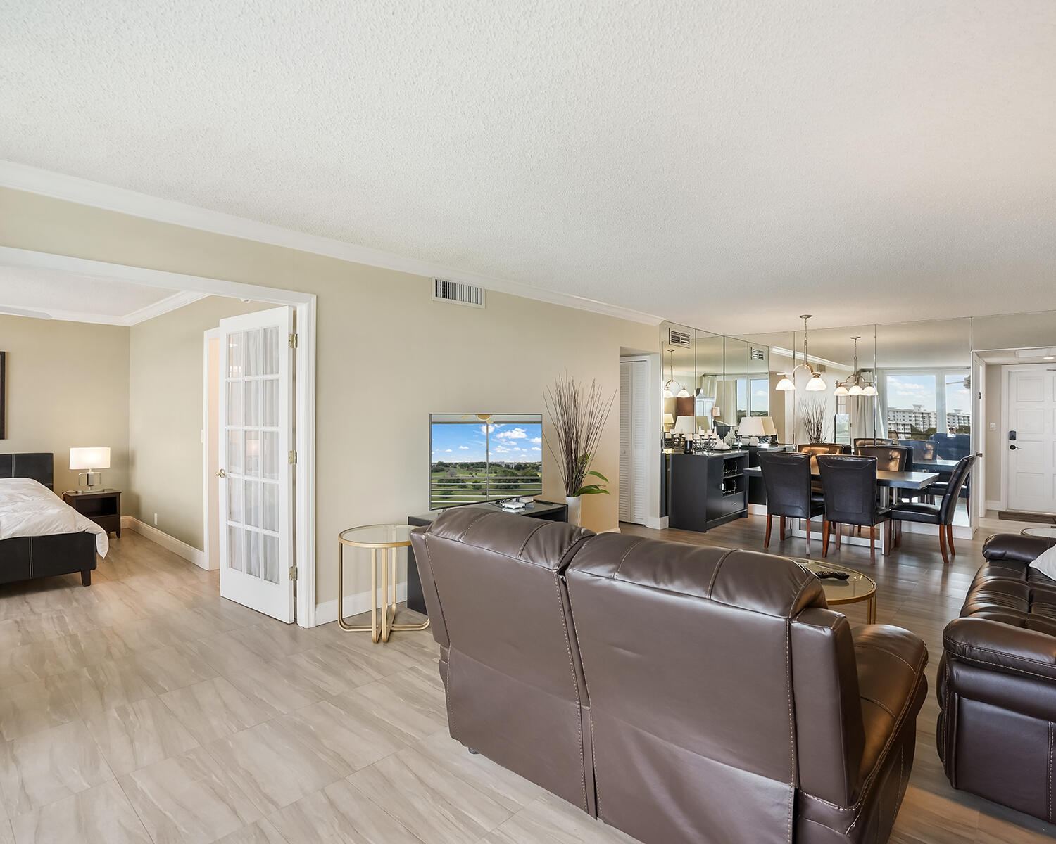 2671 South Course Drive, Unit 907 Pompano Beach, FL 33069 - Photo 15 of 21 a living room with furniture and a wooden floor