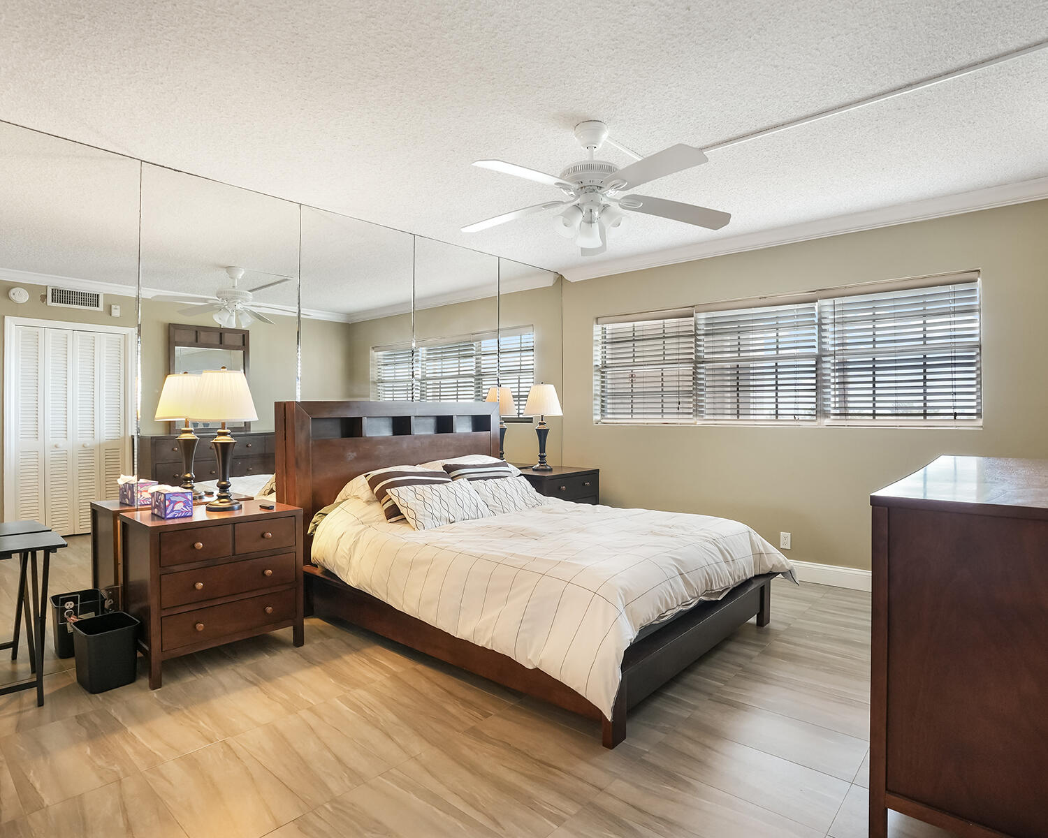 2671 South Course Drive, Unit 907 Pompano Beach, FL 33069 - Photo 17 of 21 a bedroom with a bed and a window