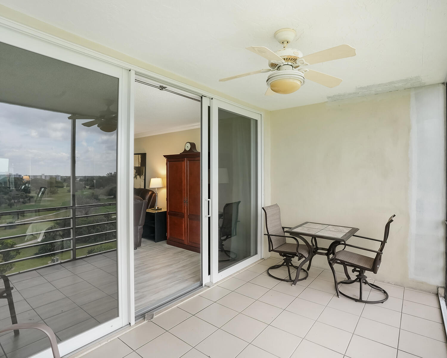 2671 South Course Drive, Unit 907 Pompano Beach, FL 33069 - Photo 20 of 21 a view of an entryway with a glass door and glass door