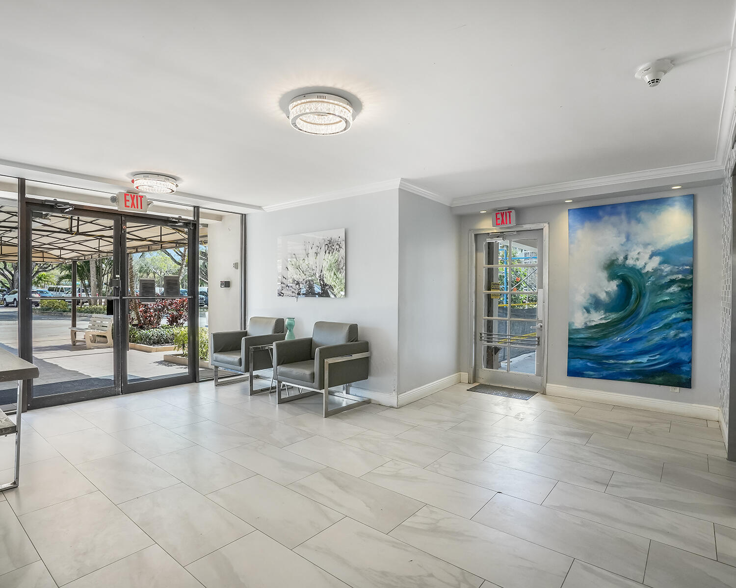 2671 South Course Drive, Unit 907 Pompano Beach, FL 33069 - Photo 21 of 21 a view of a livingroom with lounge chair and a large window