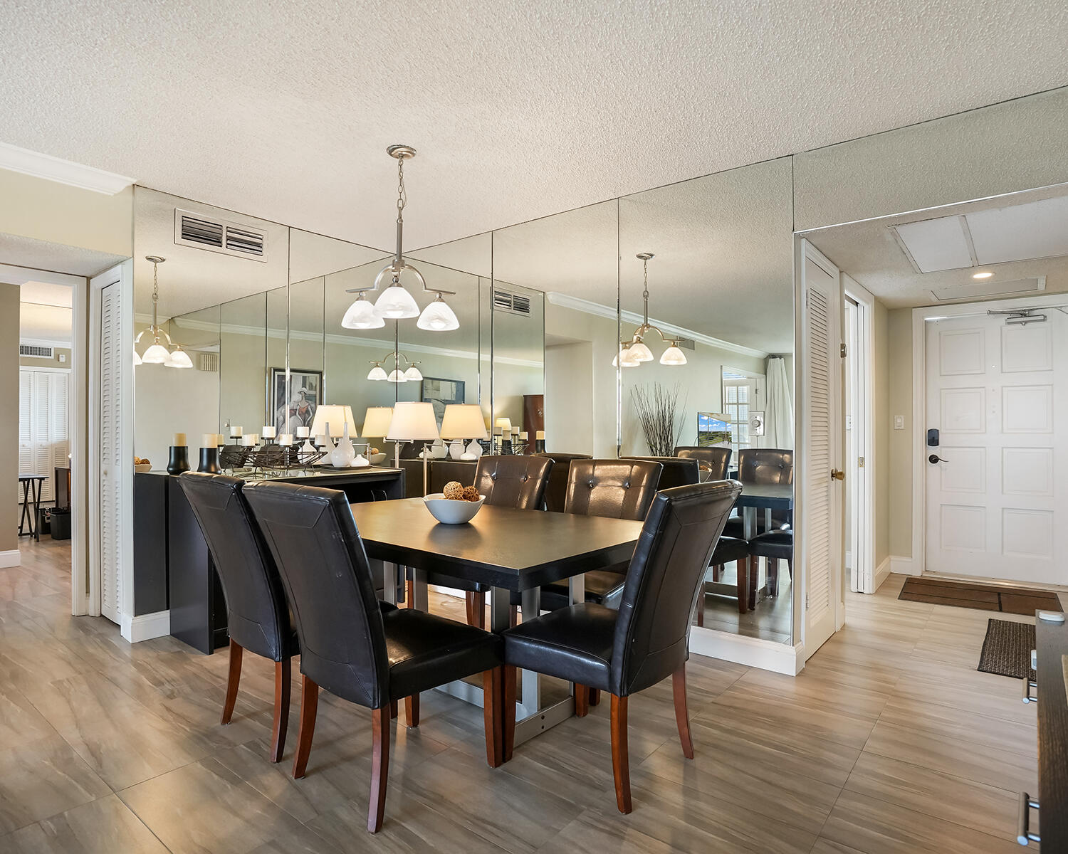 2671 South Course Drive, Unit 907 Pompano Beach, FL 33069 - Photo 3 of 21 a large kitchen with a table and chairs
