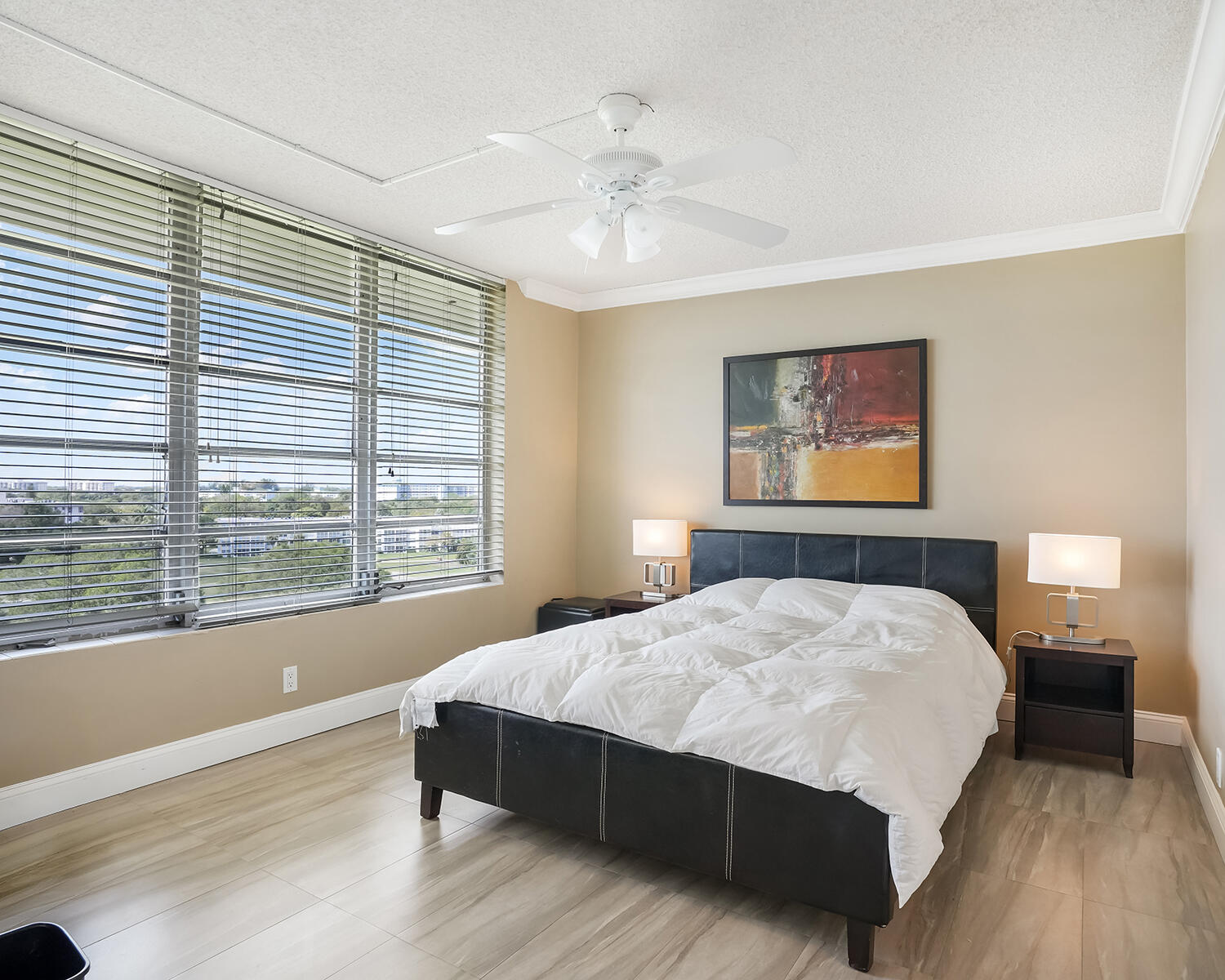 2671 South Course Drive, Unit 907 Pompano Beach, FL 33069 - Photo 5 of 21 a bedroom with a large bed and a window