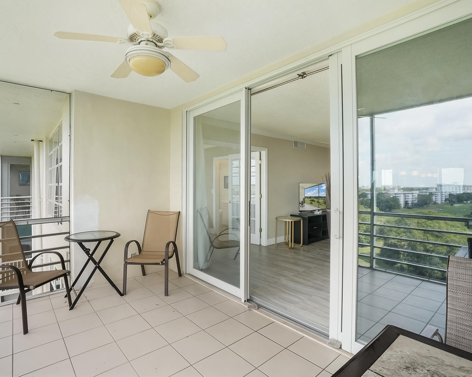 2671 South Course Drive, Unit 907 Pompano Beach, FL 33069 - Photo 10 of 21 a view of a livingroom with furniture and front door
