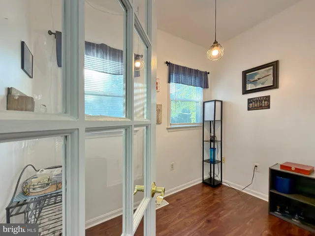 a view of a livingroom with furniture and a window