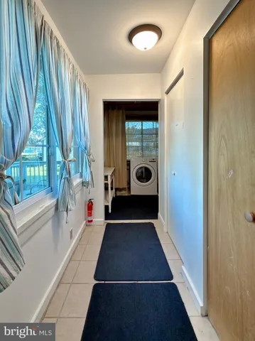a bathroom with a tub and a window