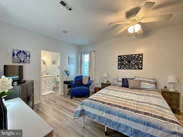 a bathroom with a toilet a sink and a mirror
