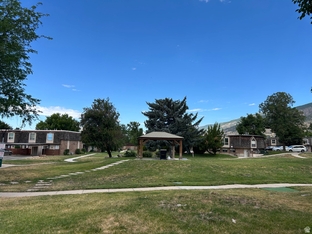 88 West 50 South, Unit C1 Centerville, UT 84014 - Photo 2 of 16 Expansive green space featuring a central gazebo structure