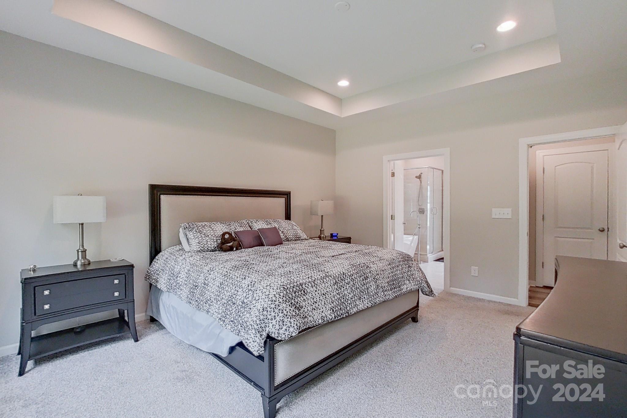 2460 Fay Jones Road Denver, NC 28037 - Photo 13 of 32 a bedroom with a bed and a night stand