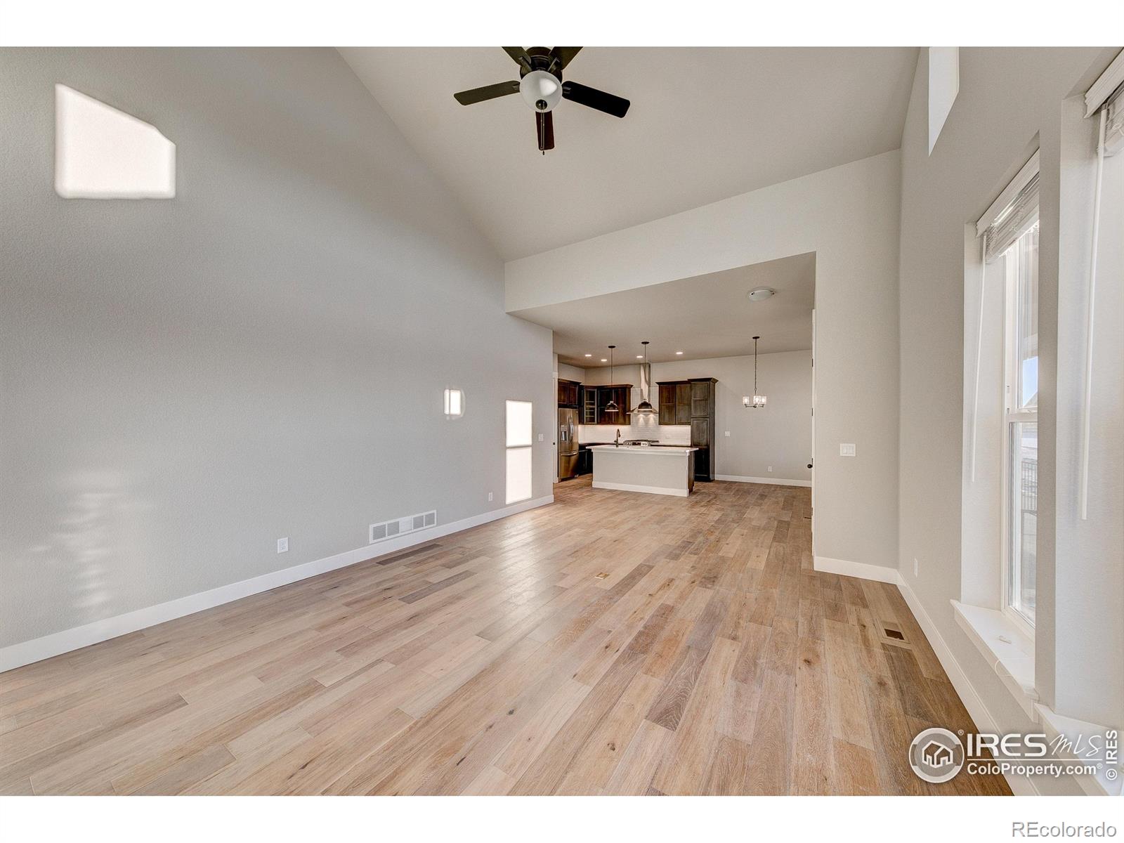 6227 Vernazza Way, Unit 4 Windsor, CO 80550 - Photo 11 of 15 a view of empty room with wooden floor
