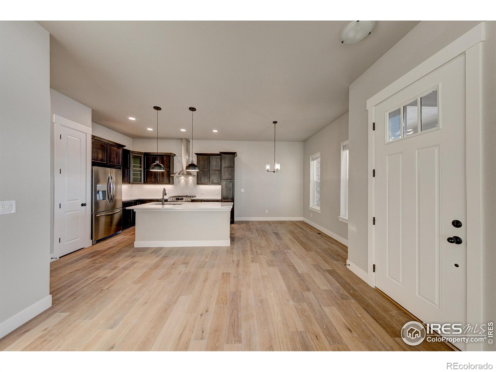 6227 Vernazza Way, Unit 4 Windsor, CO 80550 - Photo 9 of 15 a view of kitchen with wooden floor