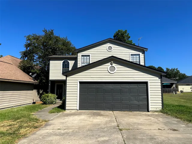 a front view of a house with a garage