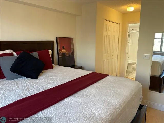 a bedroom with a bed and a closet