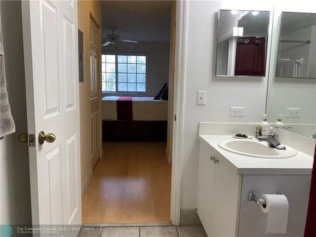 a en suite bathroom with a sink and a mirror