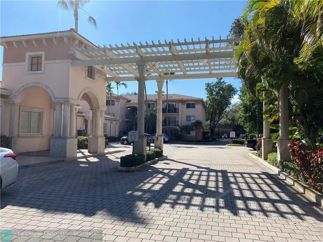 a view of a building with sitting area