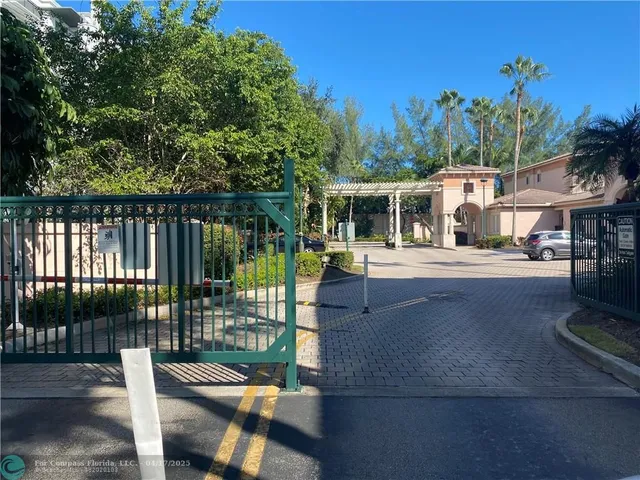 a view of a patio with couches table and chairs and potted plants