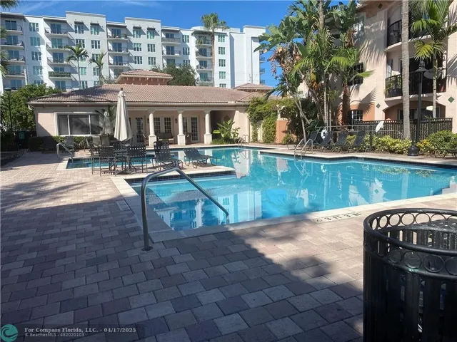 a view of a house with backyard porch and sitting area