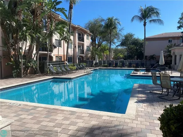 a view of a swimming pool with a patio