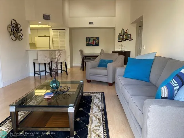 a living room with furniture and a rug