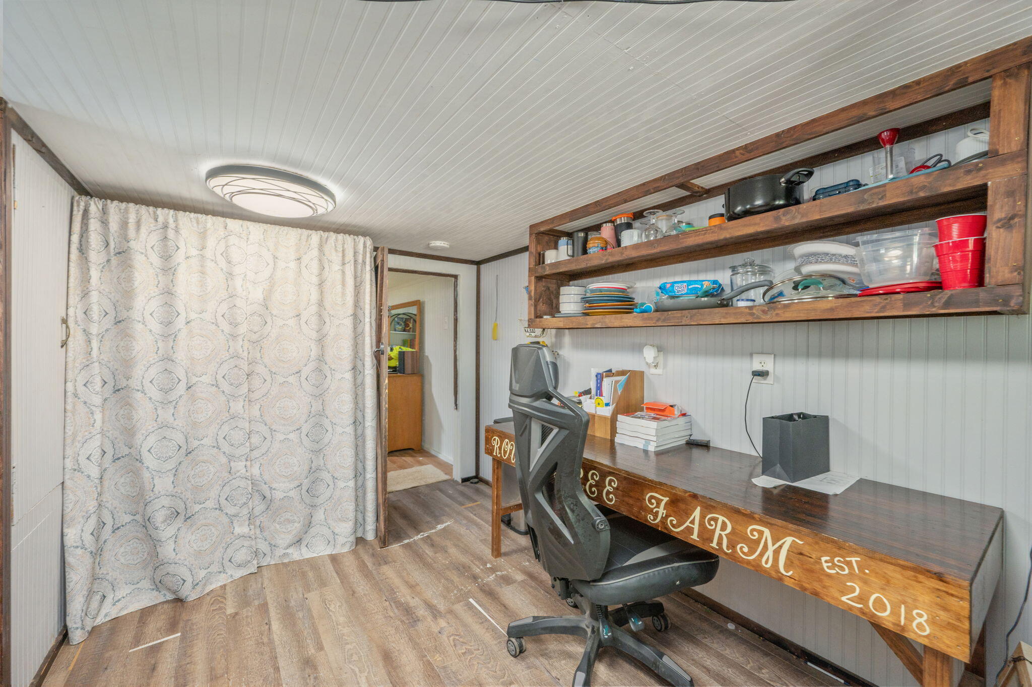 8362 Davis Road Laurel Hill, FL 32567 - Photo 18 of 53 a bedroom with furniture and a book shelf