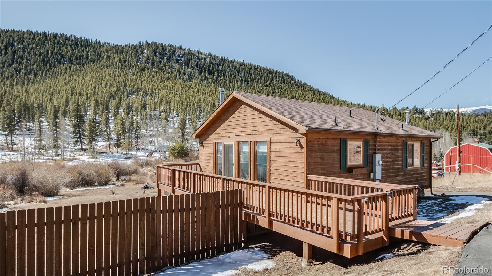 302 Bishop Road Bailey, CO 80421 - Photo 2 of 19 a view of a house with wooden fence