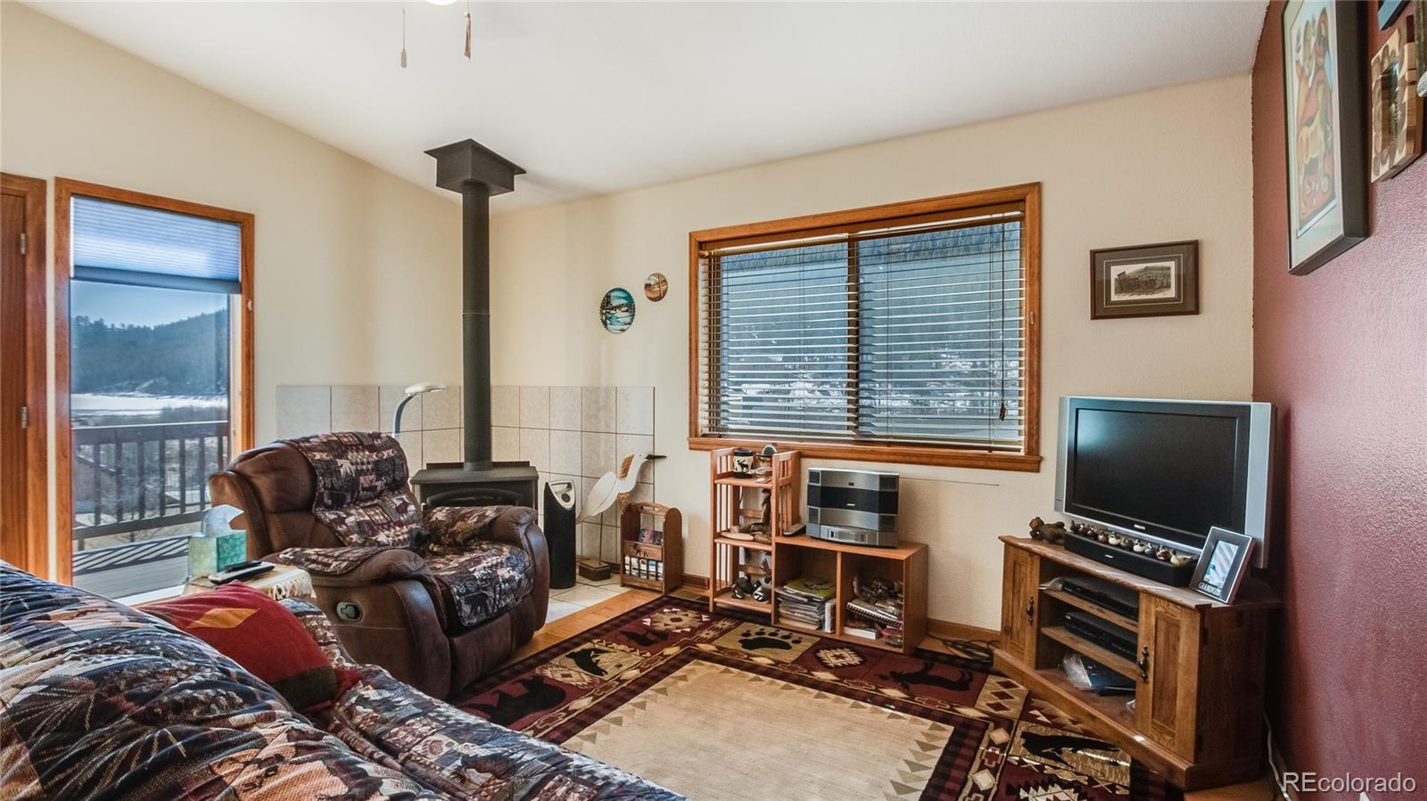 302 Bishop Road Bailey, CO 80421 - Photo 6 of 19 a bedroom with furniture and a window