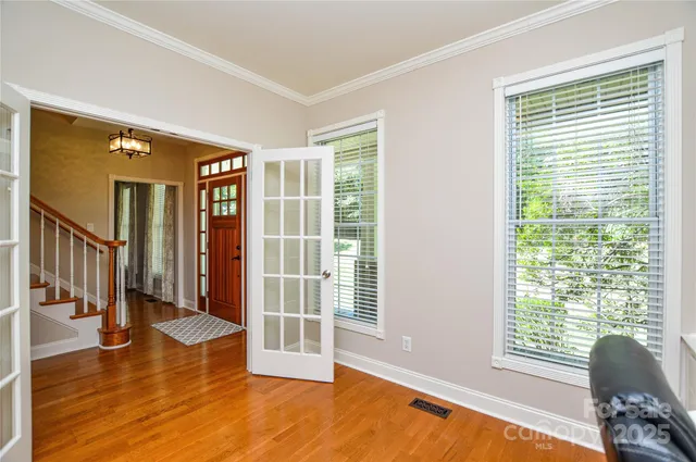 a view of livingroom with furniture wooden floor and windows