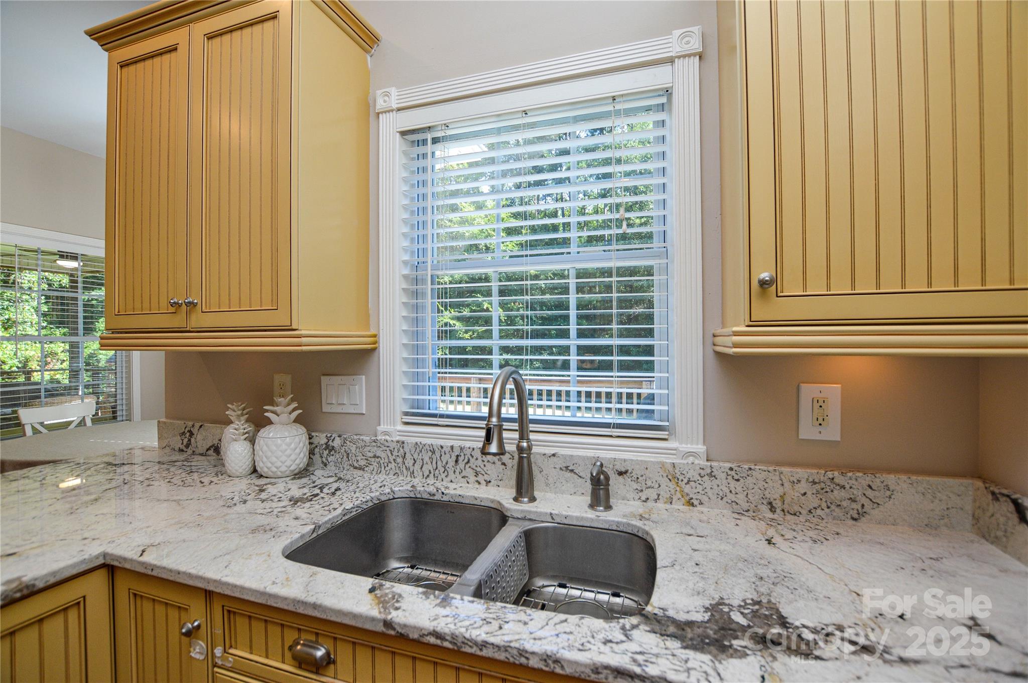 3333 Harmony Road Catawba, SC 29704 - Photo 19 of 39 a kitchen with granite countertop a sink and a window