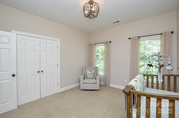 a bedroom with furniture and a window