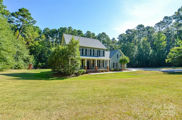 a view of a house with a big yard