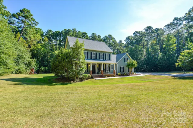a view of a house with a big yard