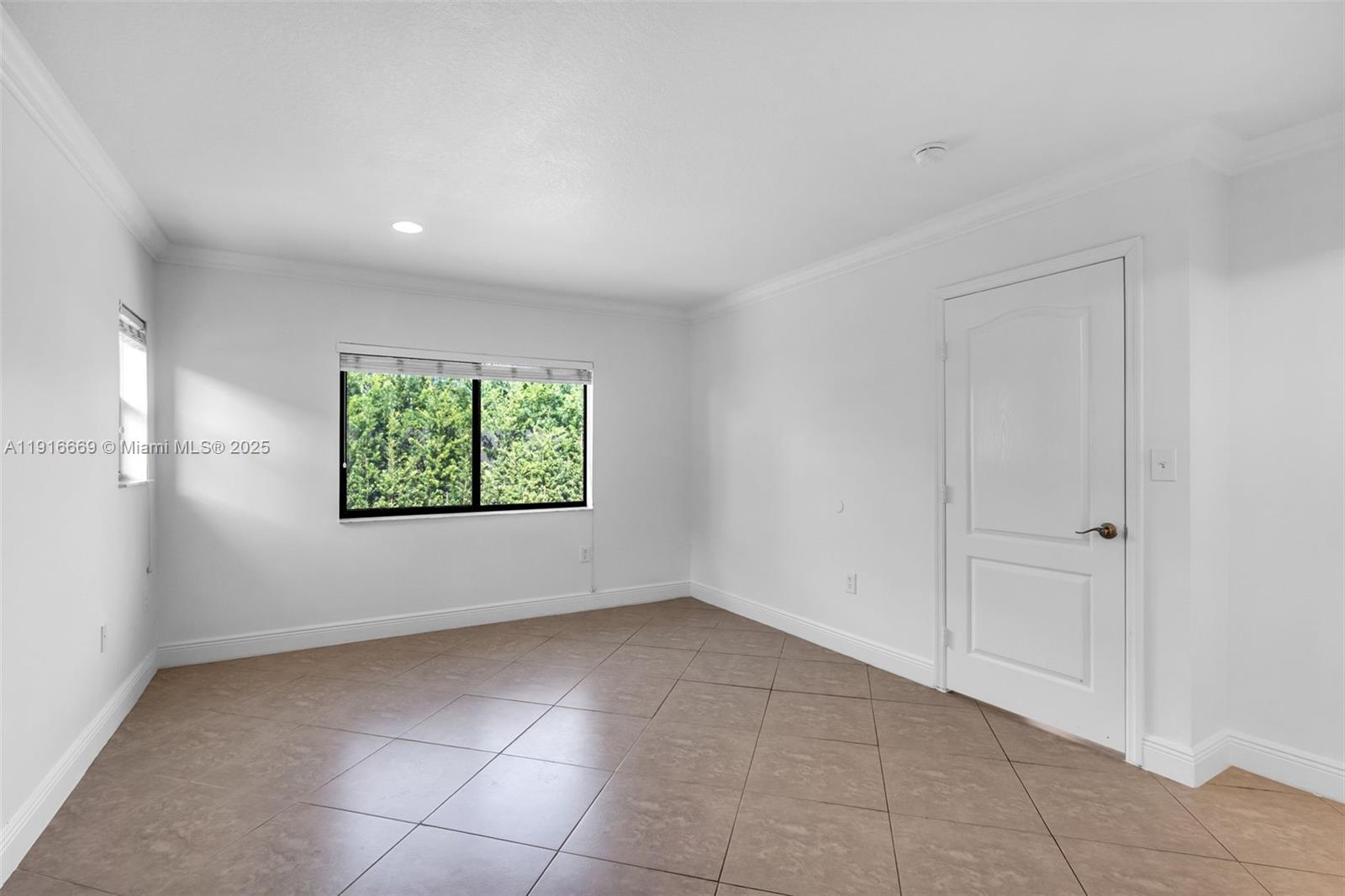 15057 Southwest 32nd Street Miami, FL 33165 - Photo 13 of 31 an empty room with windows