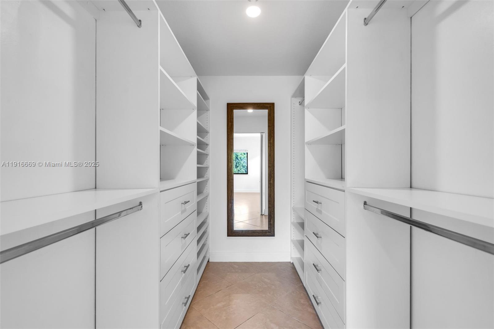 15057 Southwest 32nd Street Miami, FL 33165 - Photo 15 of 31 a bathroom with a double vanity sink and a window