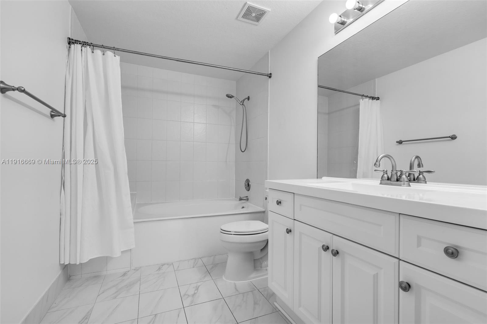15057 Southwest 32nd Street Miami, FL 33165 - Photo 18 of 31 a bathroom with a sink a toilet and shower