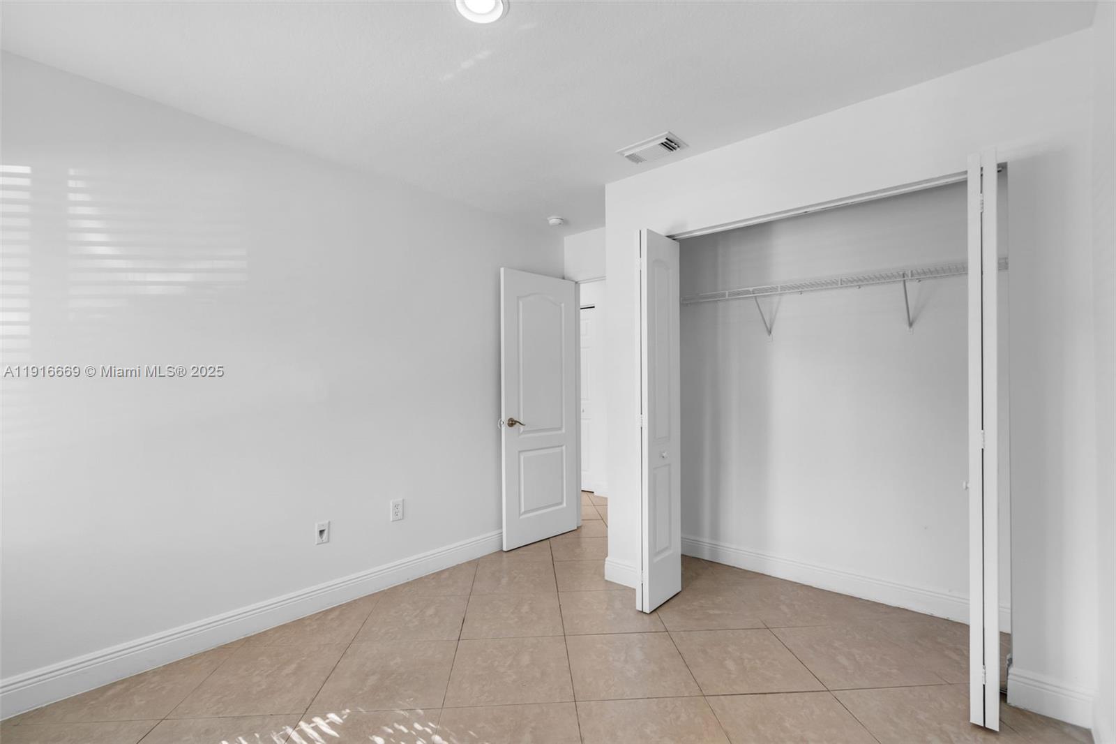 15057 Southwest 32nd Street Miami, FL 33165 - Photo 20 of 31 a view of an empty room