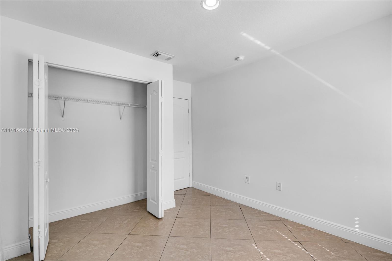 15057 Southwest 32nd Street Miami, FL 33165 - Photo 22 of 31 a view of an empty room
