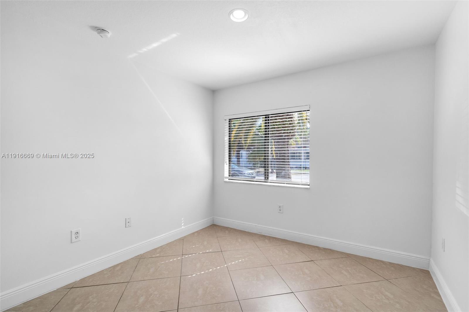 15057 Southwest 32nd Street Miami, FL 33165 - Photo 23 of 31 a view of an empty room with a window