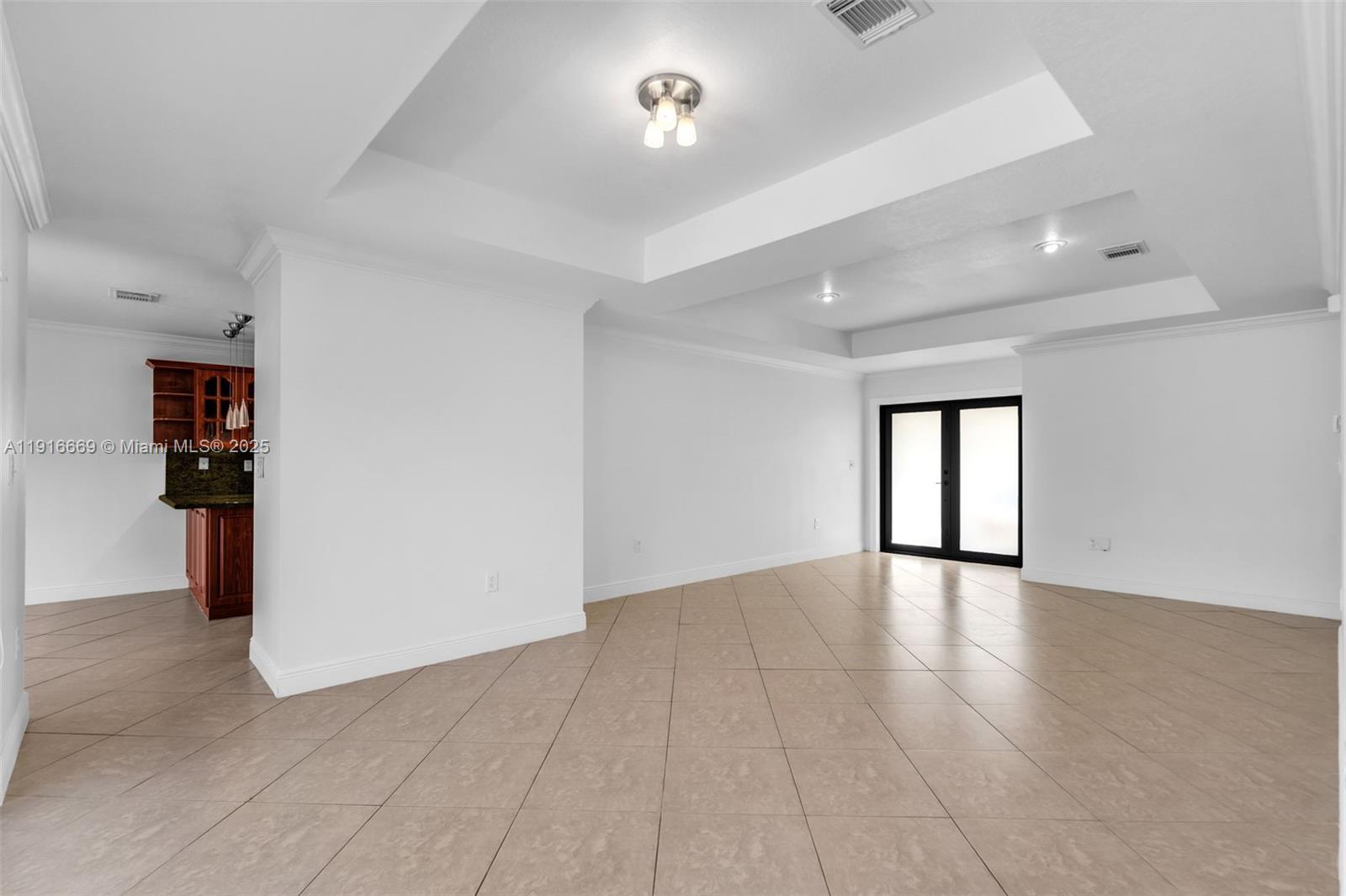 15057 Southwest 32nd Street Miami, FL 33165 - Photo 7 of 31 wooden floor in an empty room with a window
