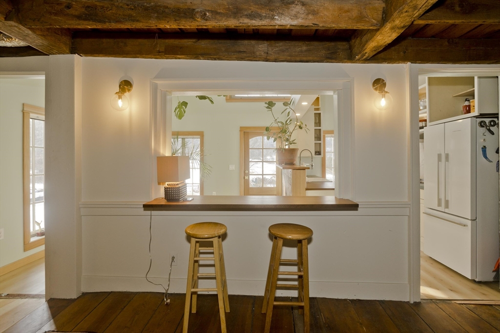 17 Old Sunderland Road Montague, MA 01351 - Photo 8 of 42 a kitchen with a refrigerator and wooden floor