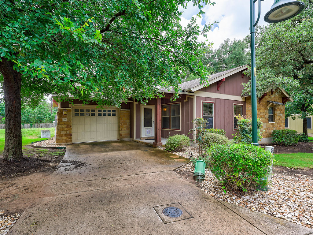 9707 Anderson Mill Road, Unit 22 Austin, TX 78750 - Photo 3 of 39 A charming single-family home with a garage and inviting landscaping.