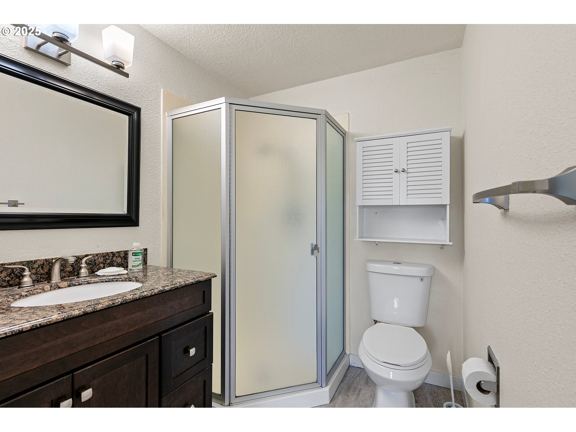 1170 Cal Young Road Eugene, OR 97401 - Photo 12 of 40 a bathroom with a granite countertop sink toilet and shower