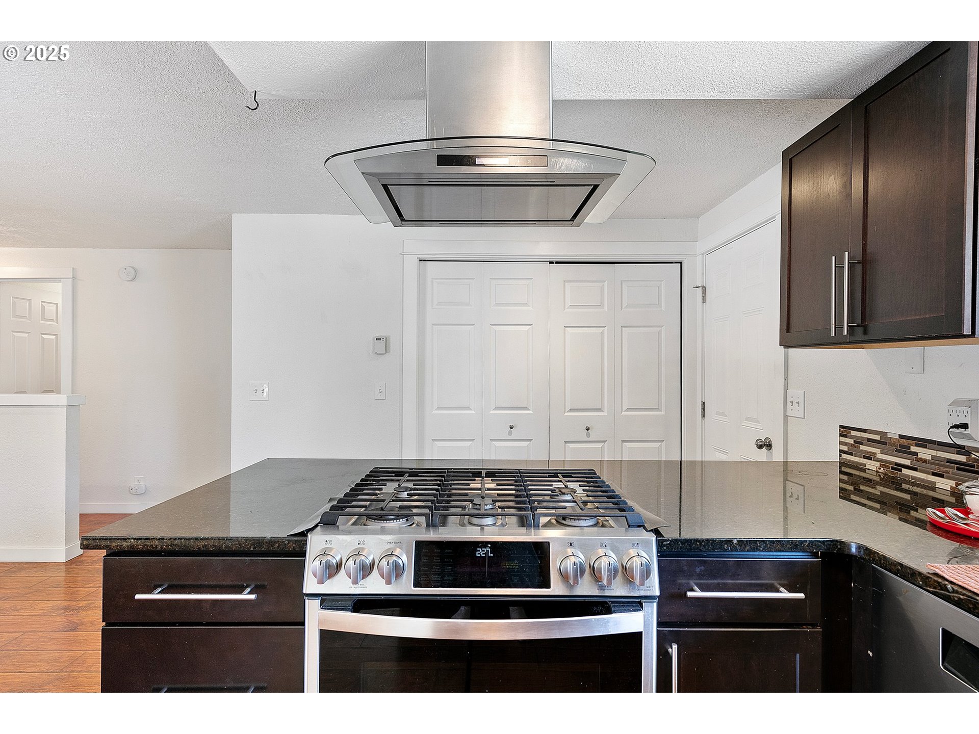 1170 Cal Young Road Eugene, OR 97401 - Photo 22 of 40 a stove top oven sitting inside of a kitchen