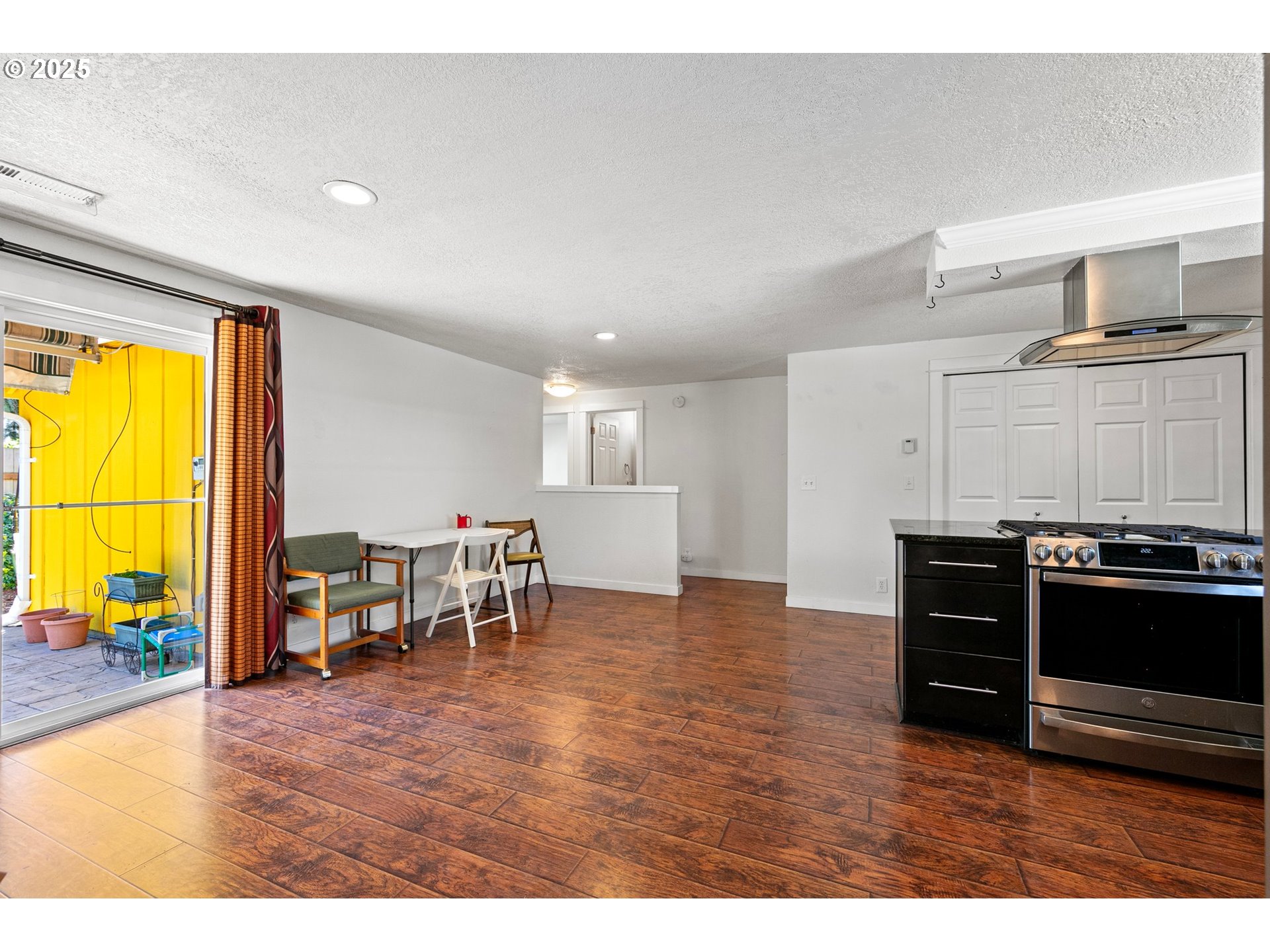 1170 Cal Young Road Eugene, OR 97401 - Photo 26 of 40 a living room with furniture and a flat screen tv